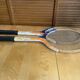 Pair of vintage wooden tennis rackets for cadet junior sport courier