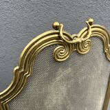 Antique brass fireplace screen from 1920, vintage spark guard.