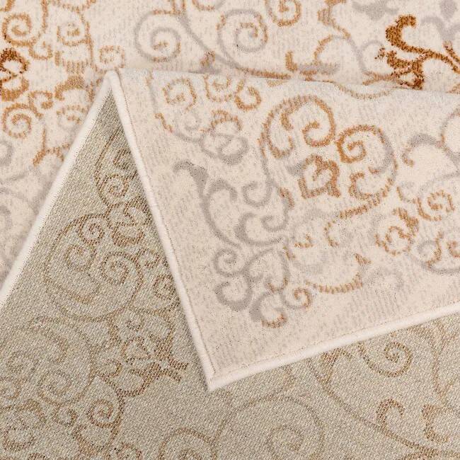 Vintage cream and brown Persian-style carpet in wool.