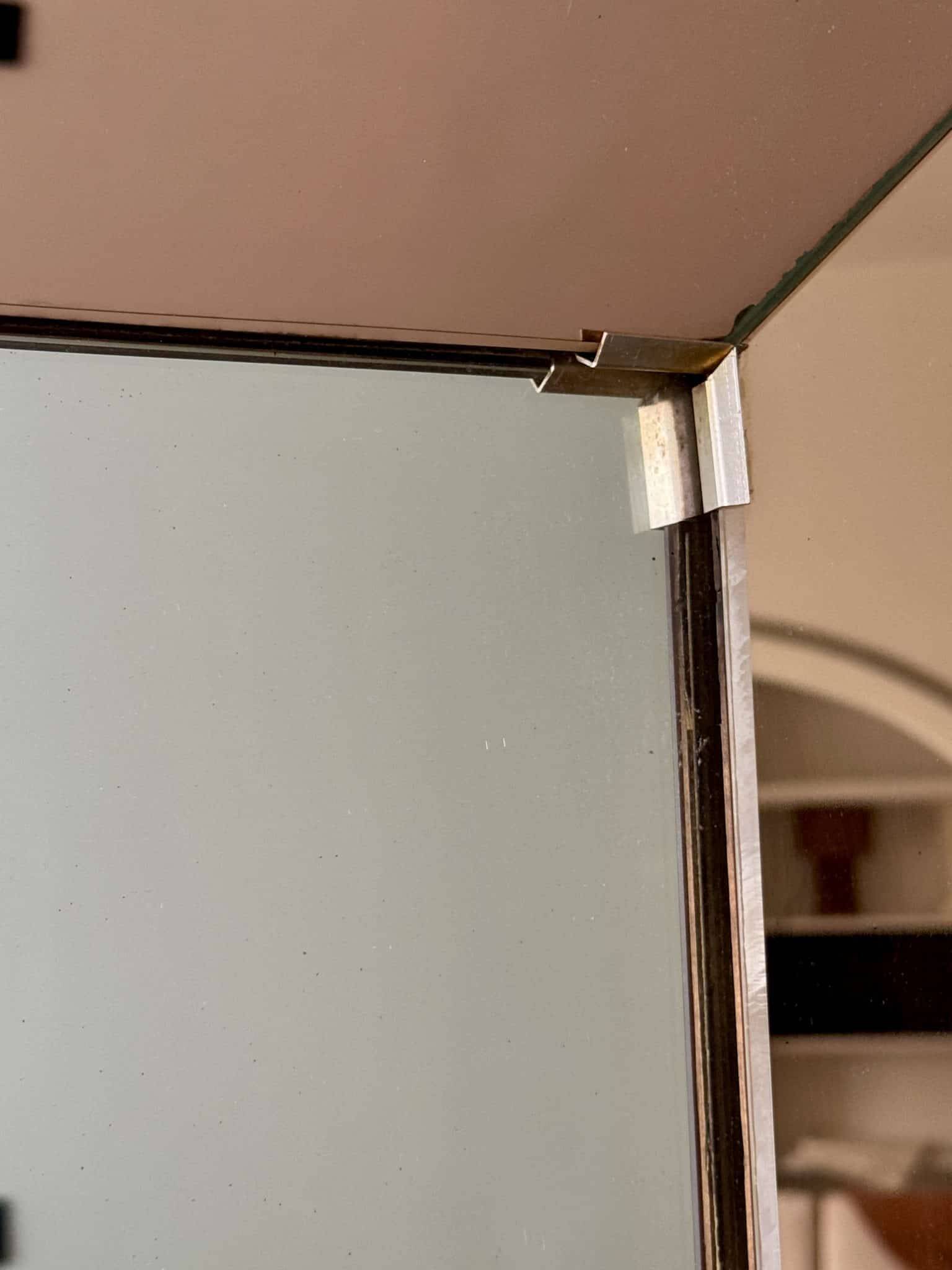 Faceted mirror with rose-coloured frame – Italy, 1980s