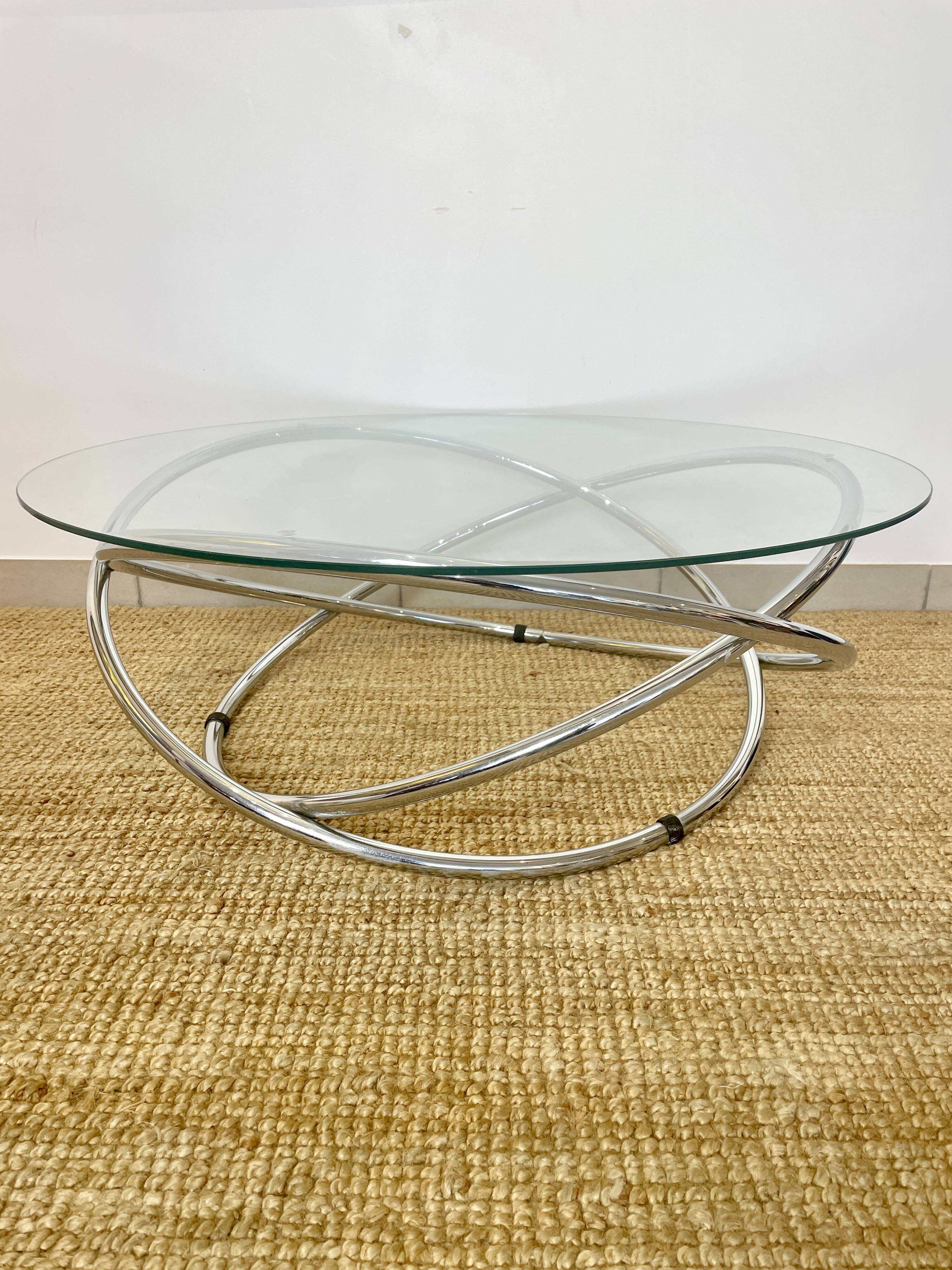 Coffee table with glass top and chrome tubular base