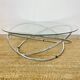 Coffee table with glass top and chrome tubular base