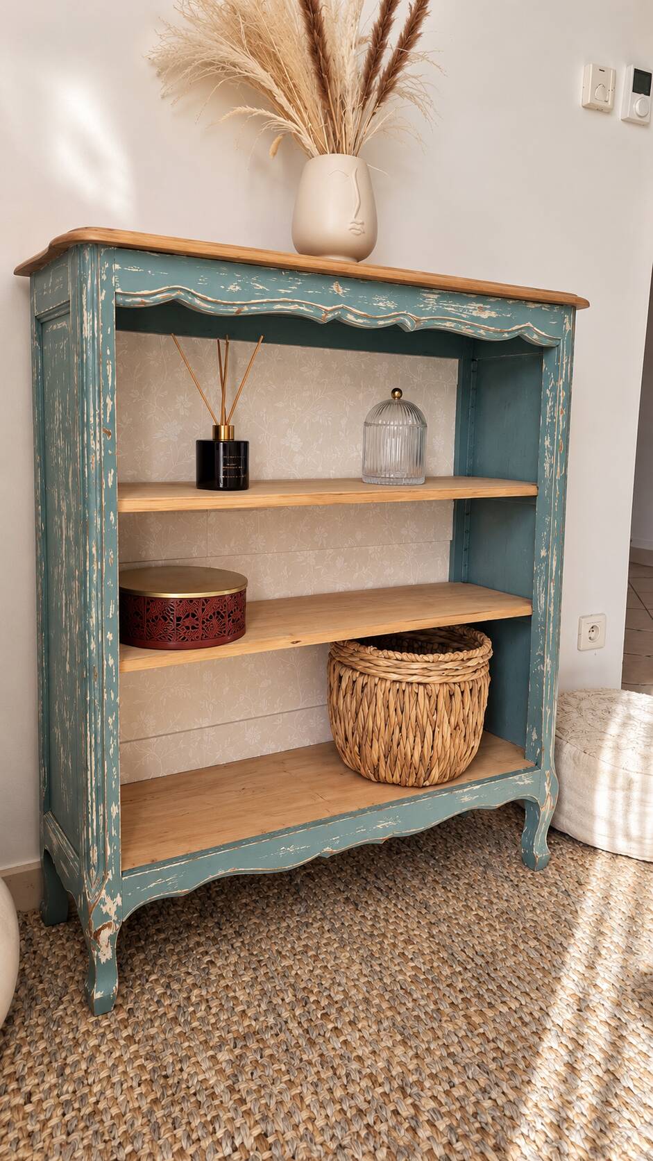 Antique wooden bookshelf with a patinated blue-green finish.