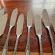 Christofle, Paris - Set of 12 fish knives - crossed ribbons model