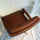 Leather and wood swivel armchair