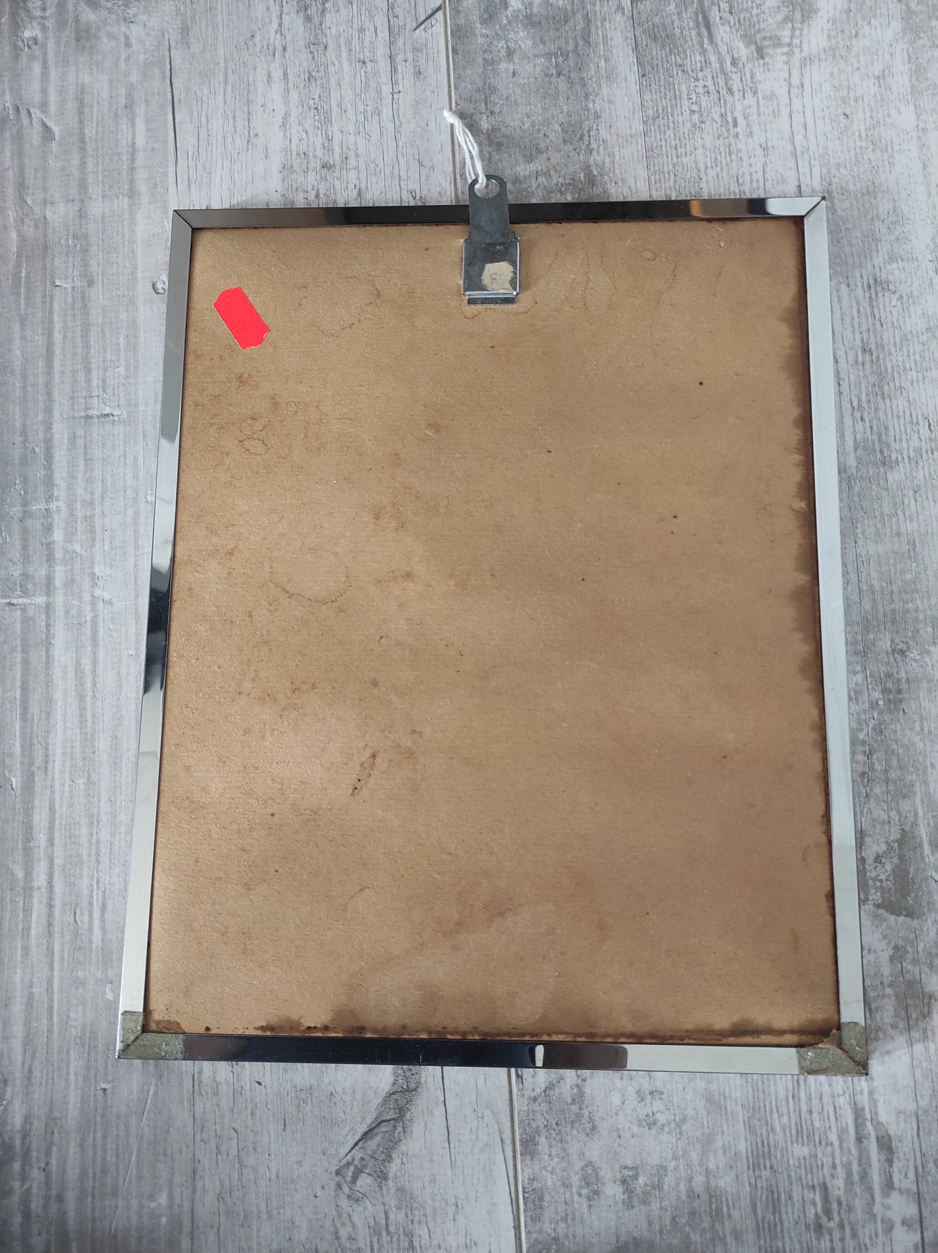 Vintage mirror with silver metal frame to hang