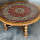 Vintage coffee table in turned wood and leather with astrological decoration.