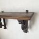 antique oak wall shelf with carved brackets