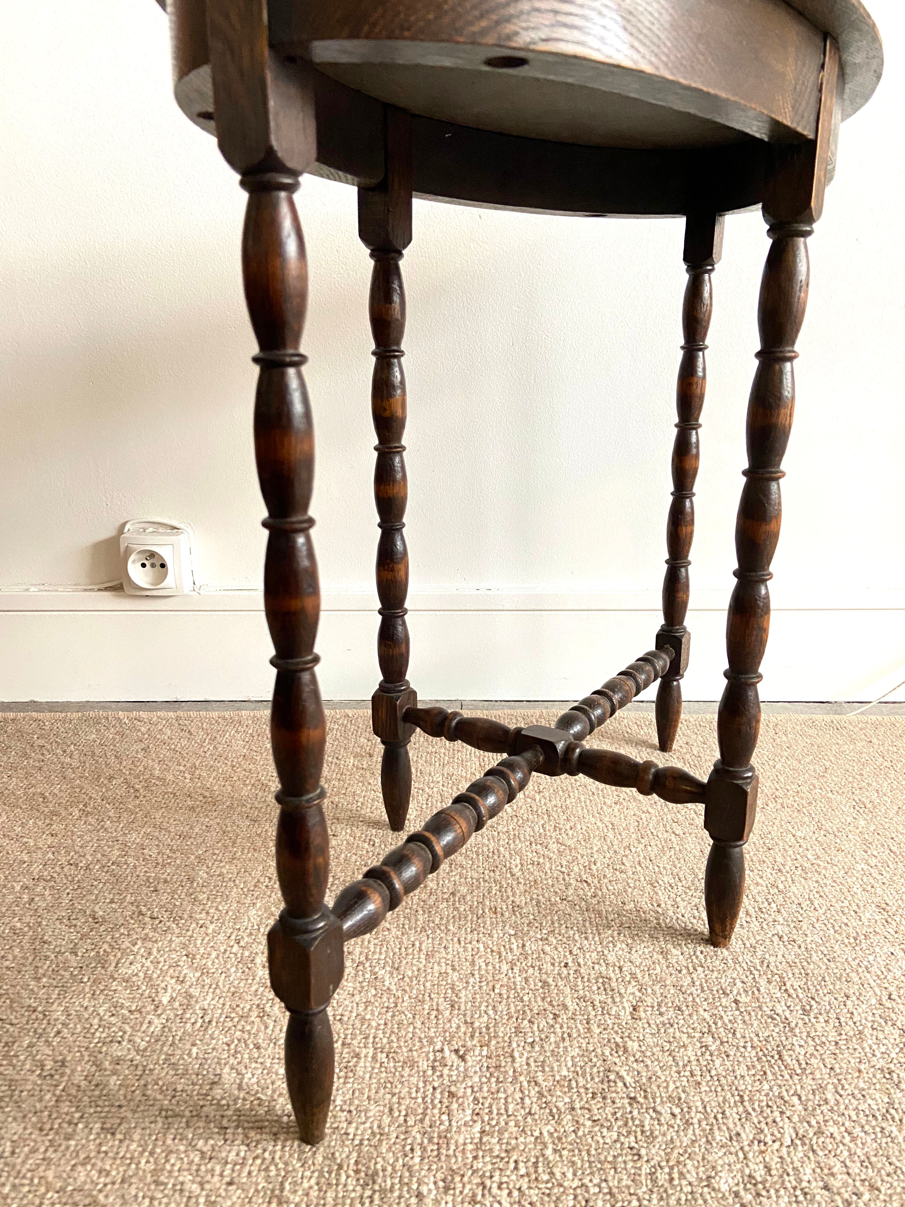 Oval wooden side table turned with spacer