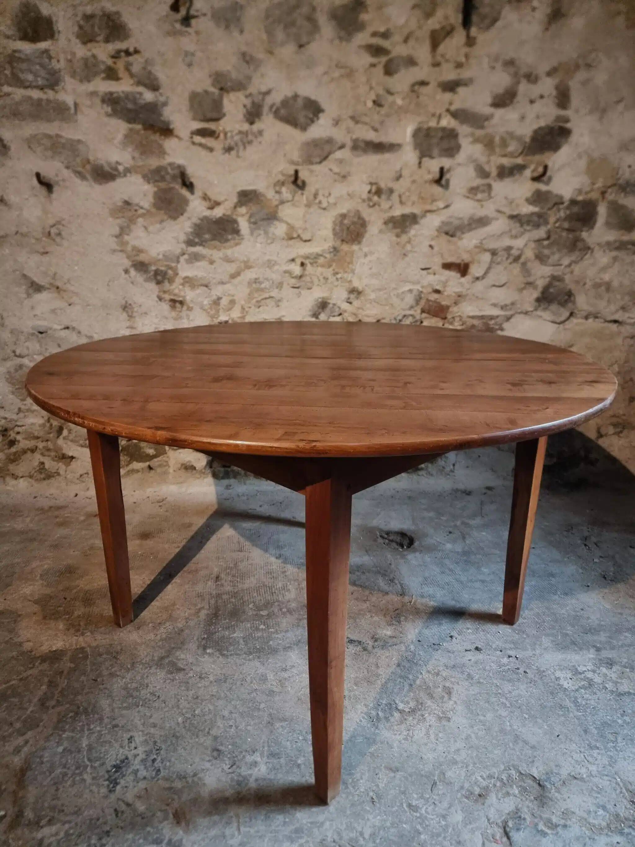 Antique round dining table in cherry wood, France, circa 1920.