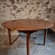 Antique round dining table in cherry wood, France, circa 1920.