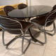 Table and chairs in the style of Gastone Rinaldi.