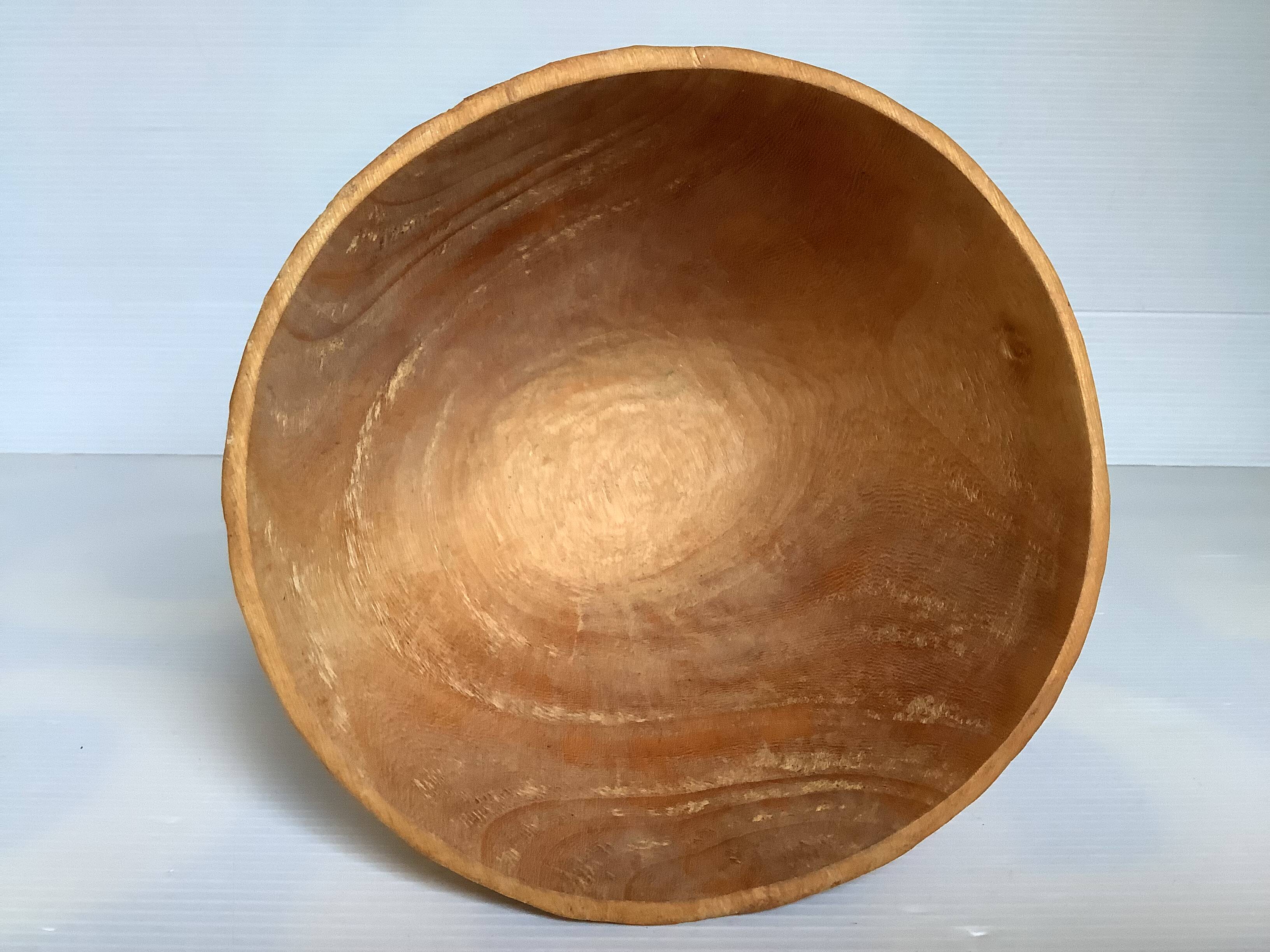 Asymmetrical wooden sculpted catchall.