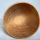 Asymmetrical wooden sculpted catchall.