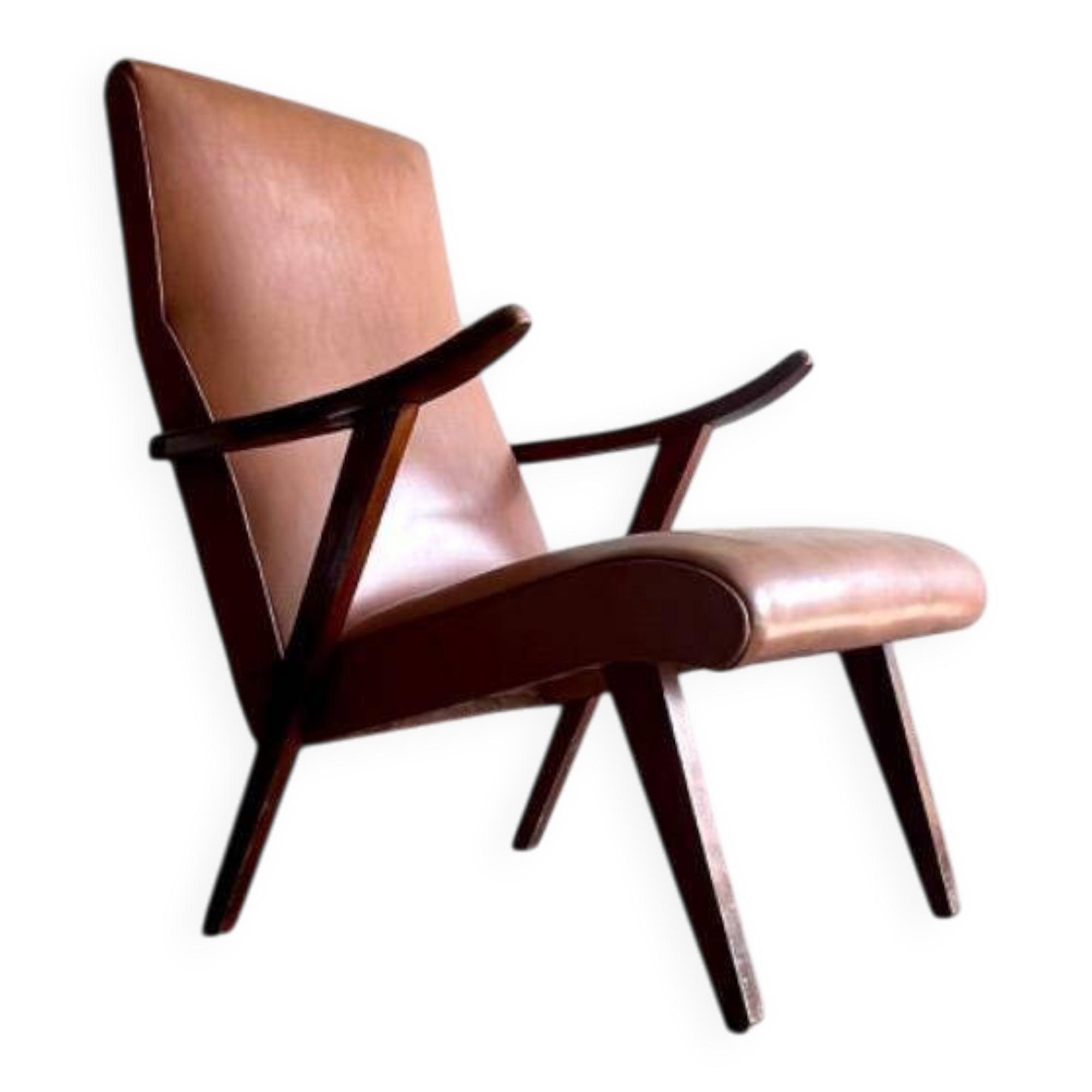 Vintage armchair from the 1950s in cognac leather and dark wood — modernist lounge chair.