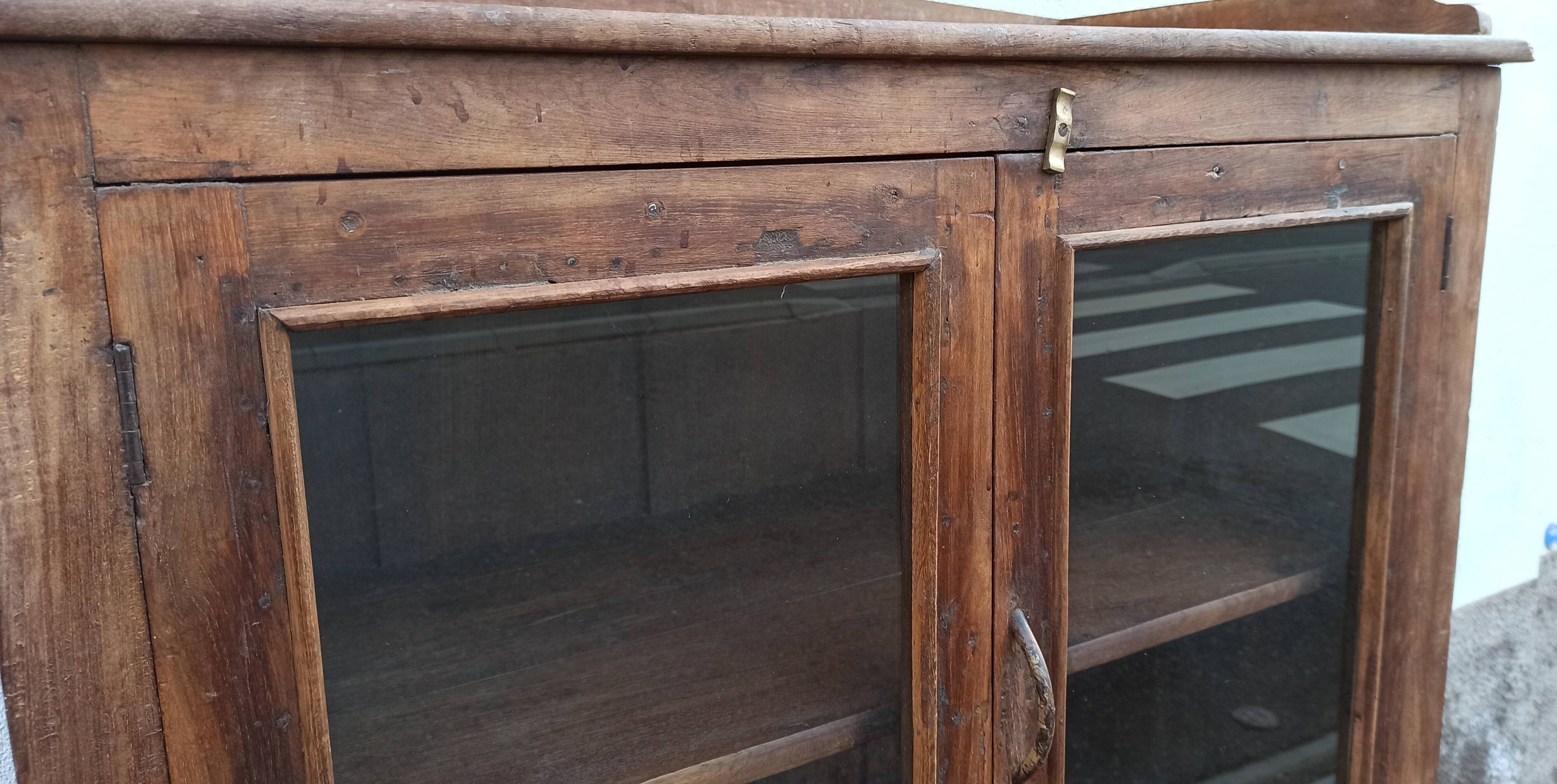 Old wooden glazed cabinet with four doors
