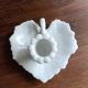 Night or hand-held porcelain candle holder in the shape of a leaf.
