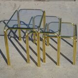 Nesting tables in gold-tone metal and glass