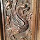Facade de porte armoire en bois scultpté.