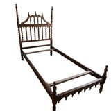 Lit en bois sculpté demi-baldaquin