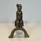 Pair of bronze andirons with seated shamans monogrammed Anton Prinner