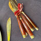 Wood and brass fish service