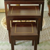 Pull-out tables in mahogany and vintage brass