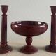 Candlesticks and bowl in speckled ceramic.