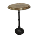 Old foot cast-iron bistro and brass round tray