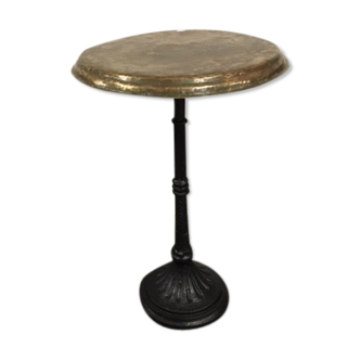 Old foot cast-iron bistro and brass round tray
