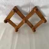 Foldable ball coat rack made of fir wood.