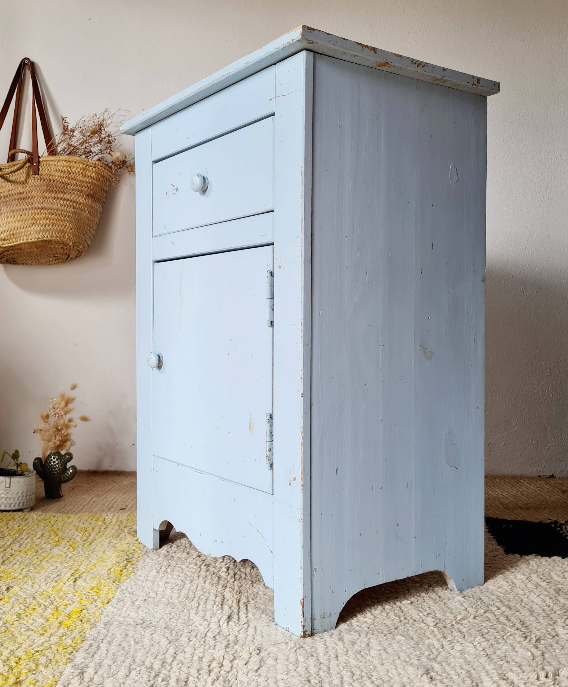 Handcrafted blue chest of drawers.