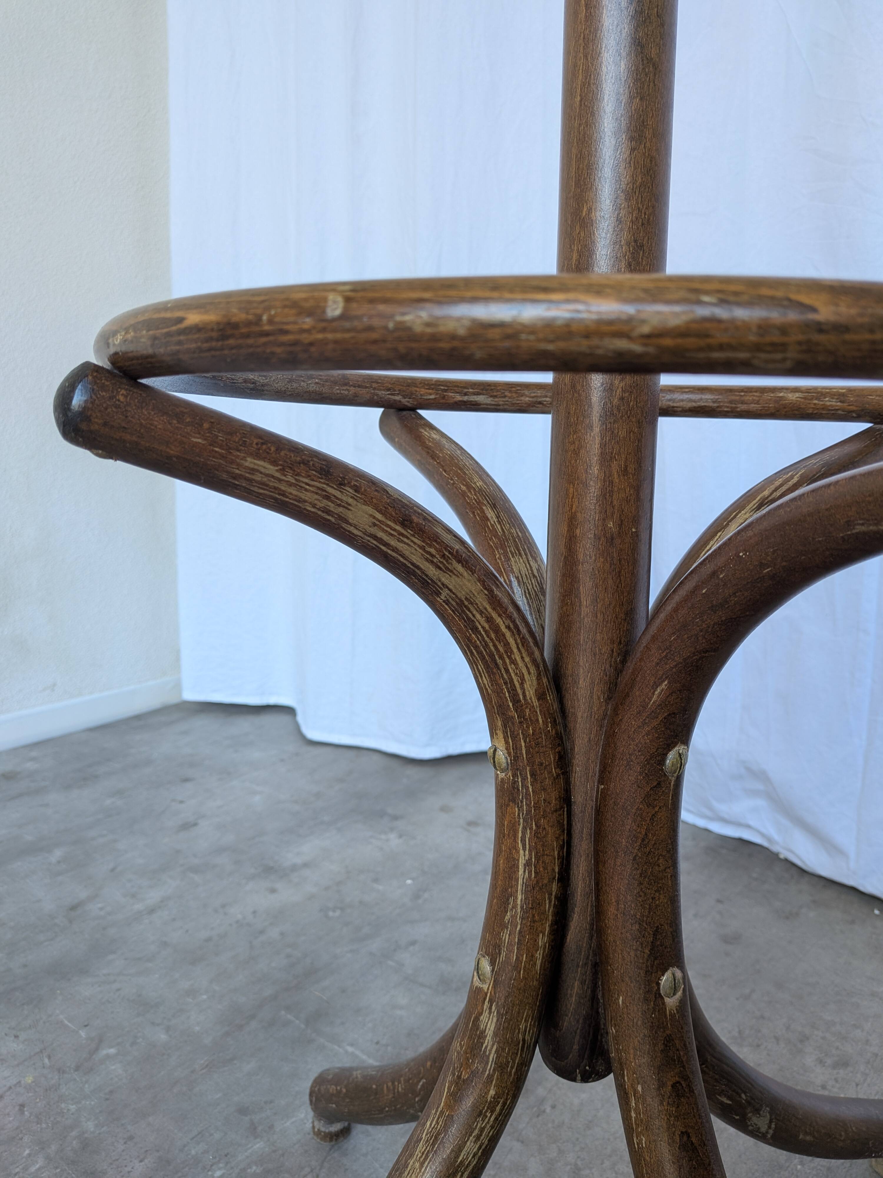 Vintage bentwood coat rack in Thonet style / Dark wood coat rack with shadow.