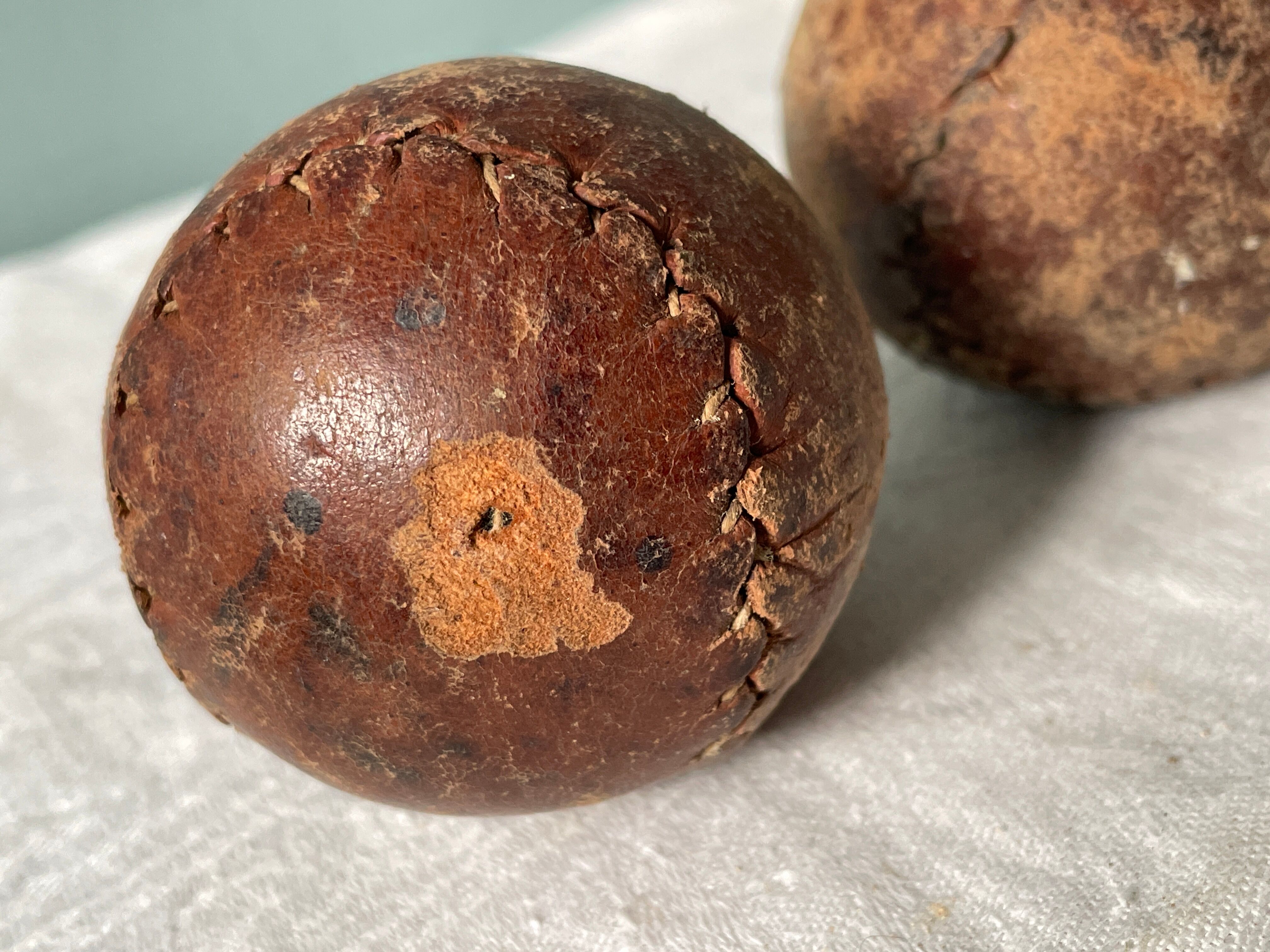 Two old nineteenth century leather golf balls