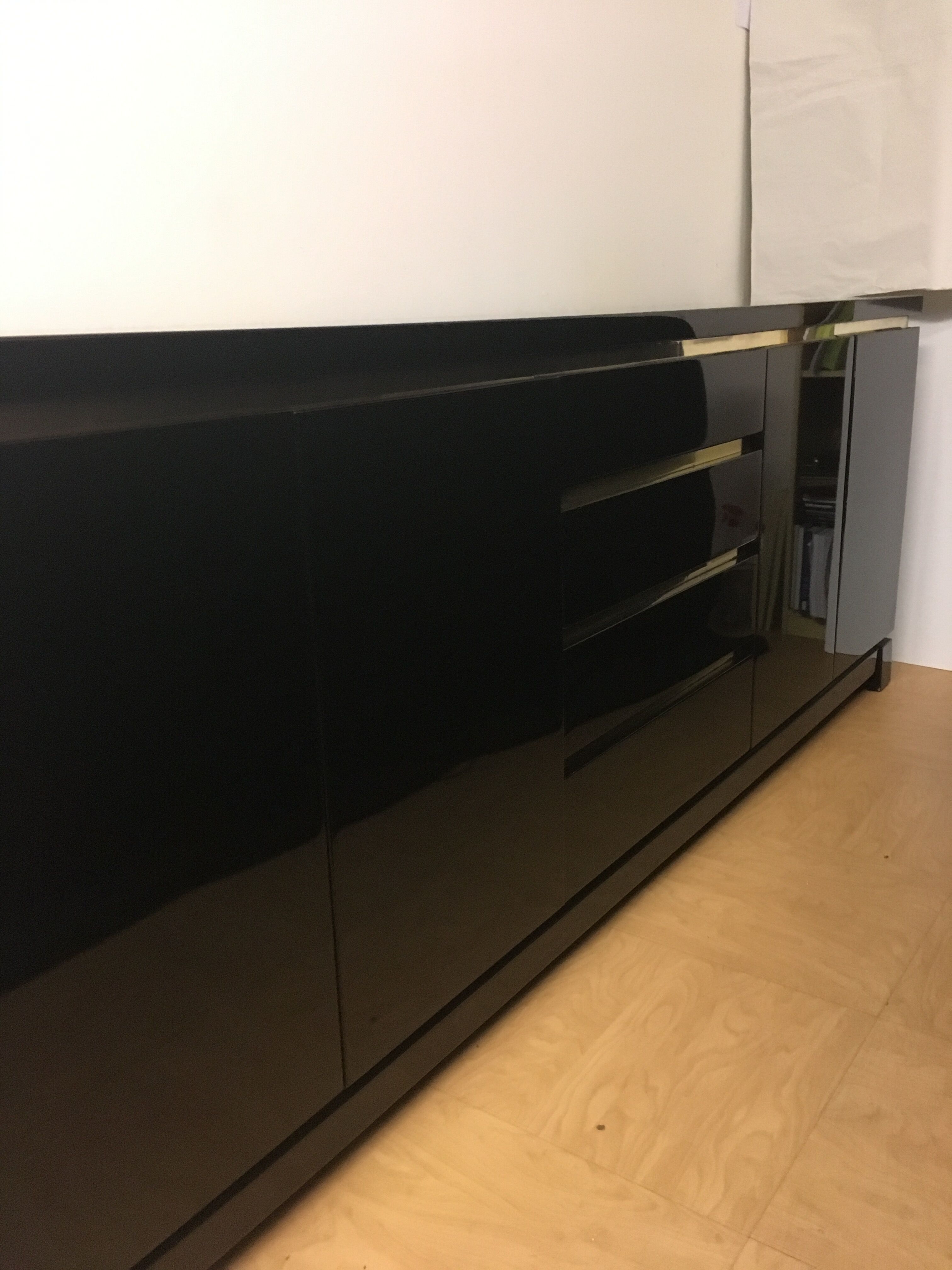 Wide row black lacquer and brass