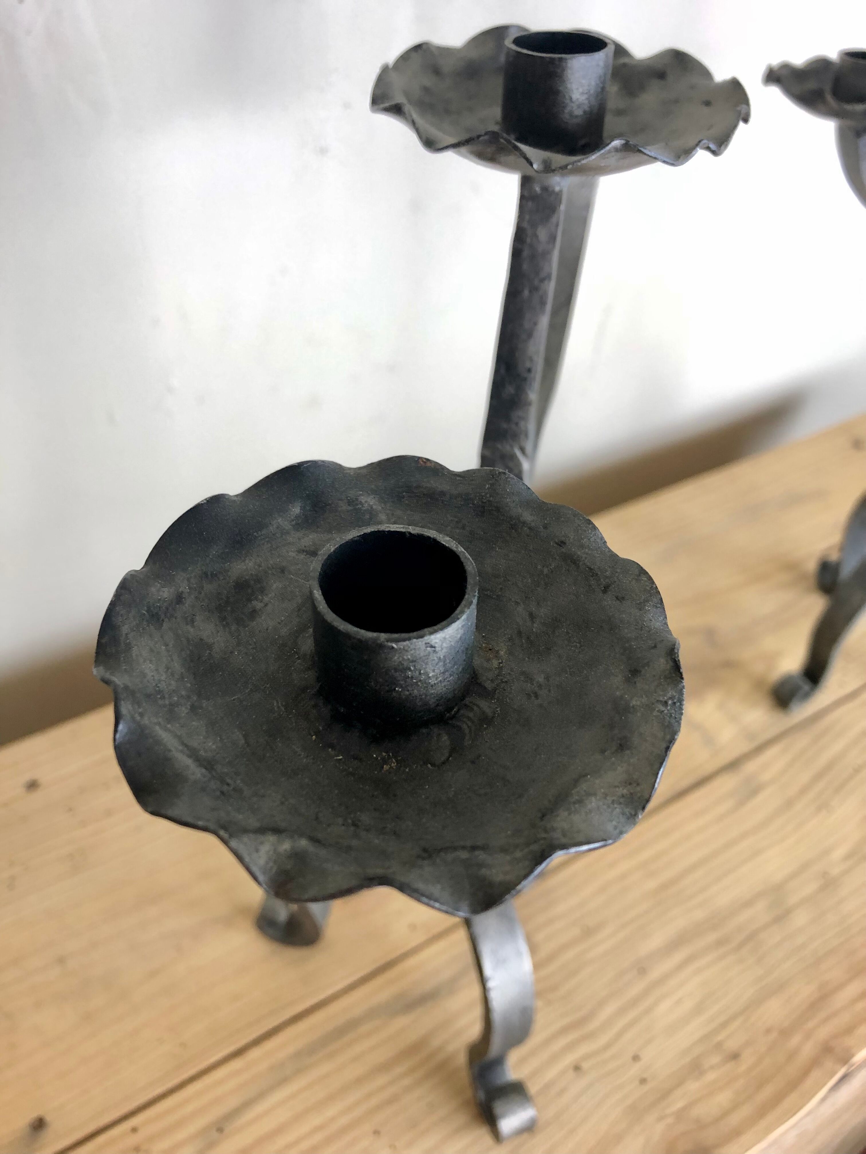 Pair of wrought iron candlesticks