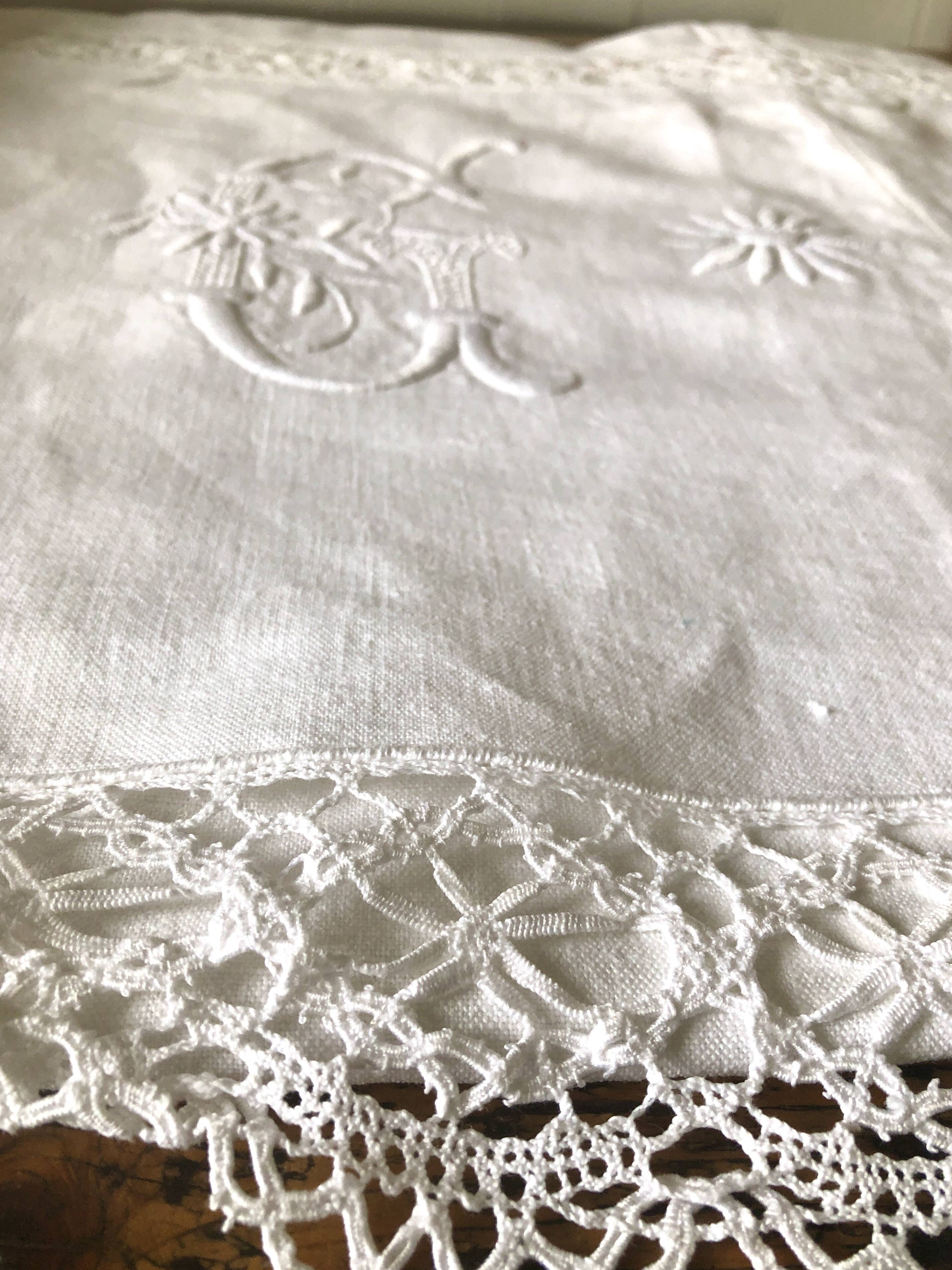Old embroidered cloth, monograms and lace