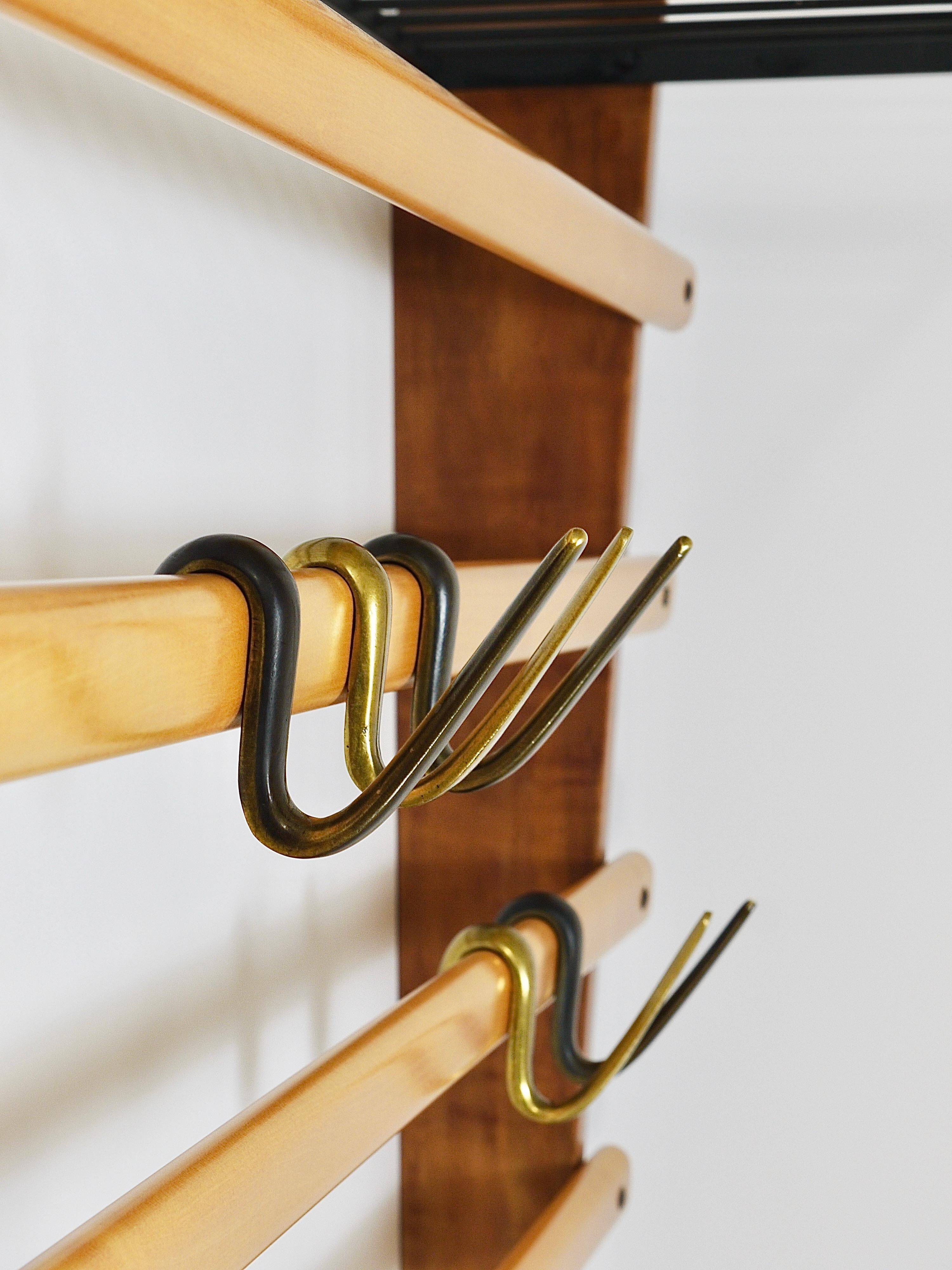 Rare coat rack by Carl Auböck with hat rack, cabinet, brass, walnut and beech, 1950s.