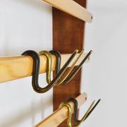 Rare coat rack by Carl Auböck with hat rack, cabinet, brass, walnut and beech, 1950s.