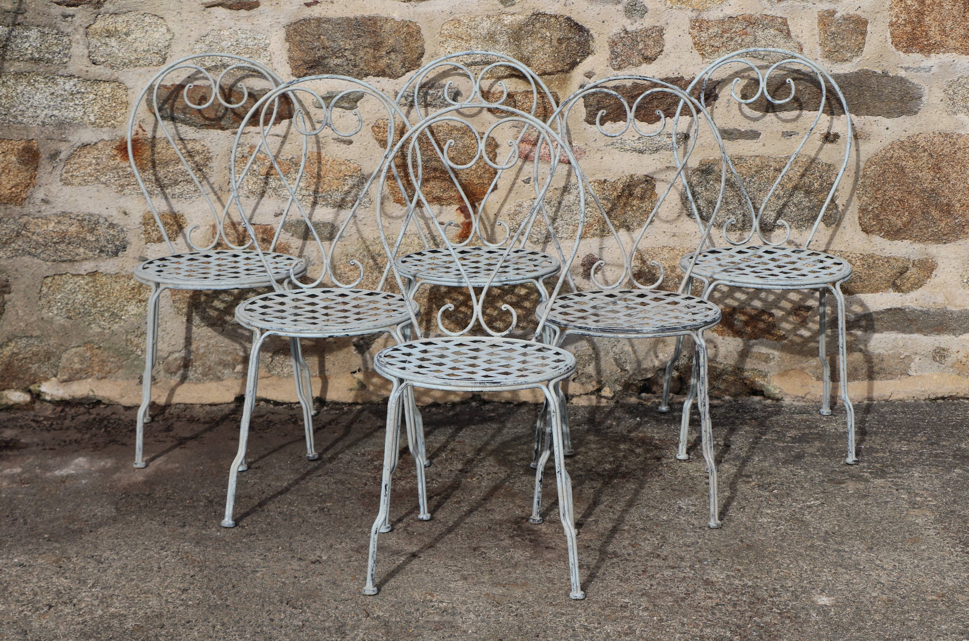 Series of 6 wrought iron garden chairs