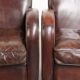 Dark cognac-coloured set of 2 sheepskin armchairs with a sleek design