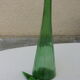 Vintage green faceted glass bottle with its cap 1970