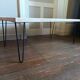 Coffee table in solid bamboo with steel legs.