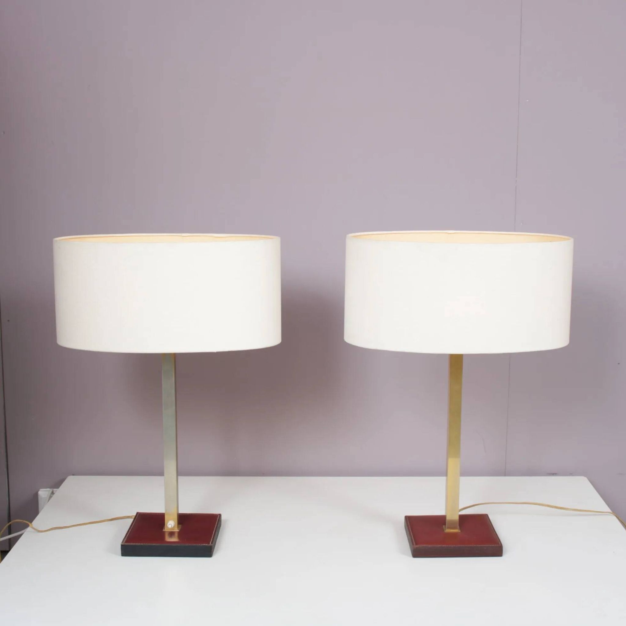 Pair of leather and brass table lamps from the 1960s, originating from Belgium.