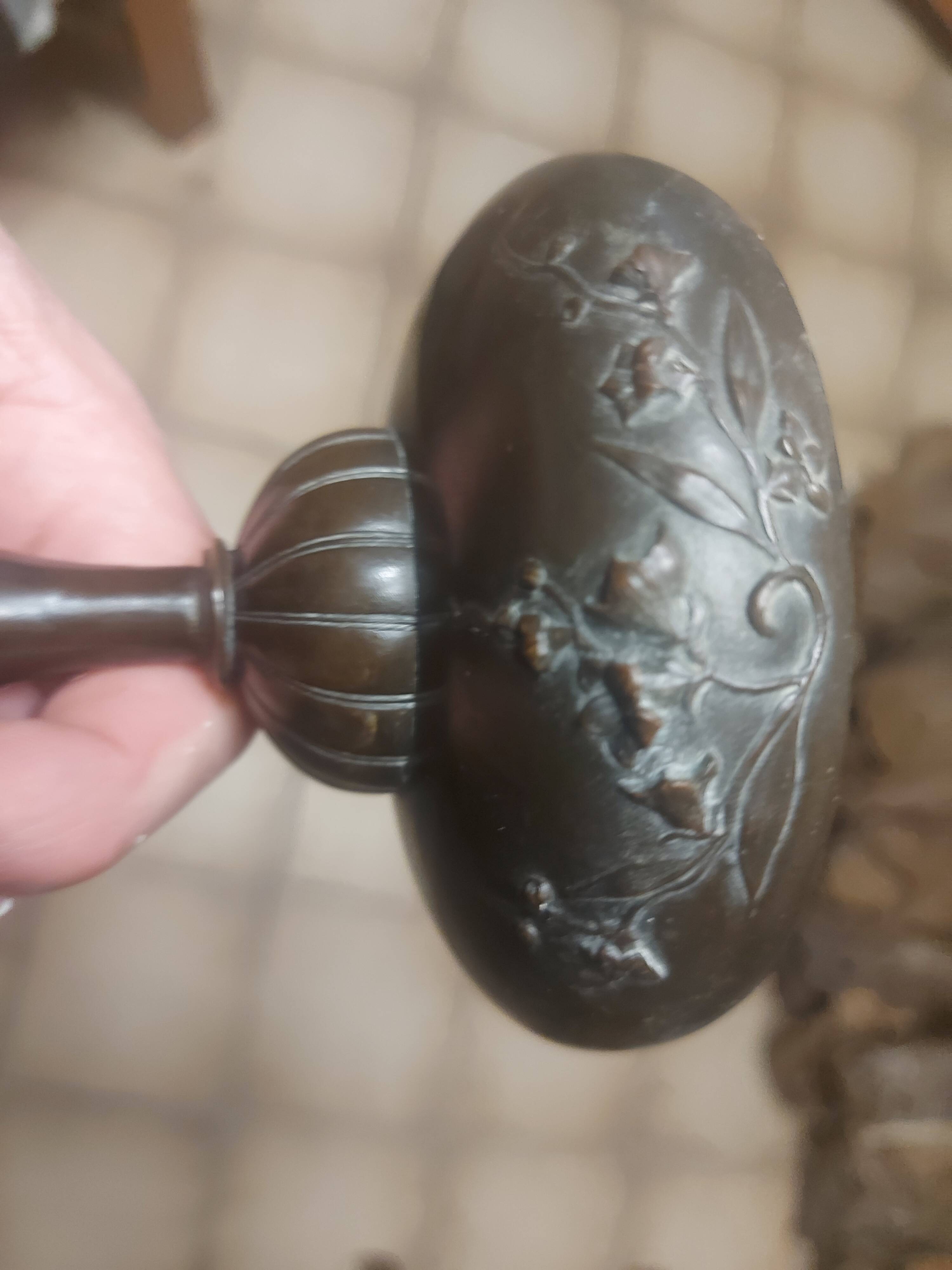 Bronze bowl on marble base