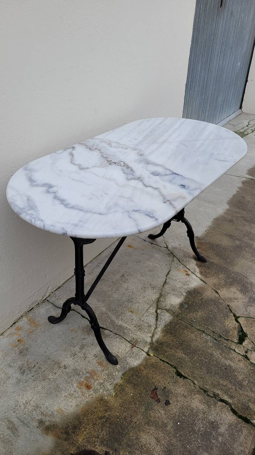 Antique cast iron bistro table with oval marble top