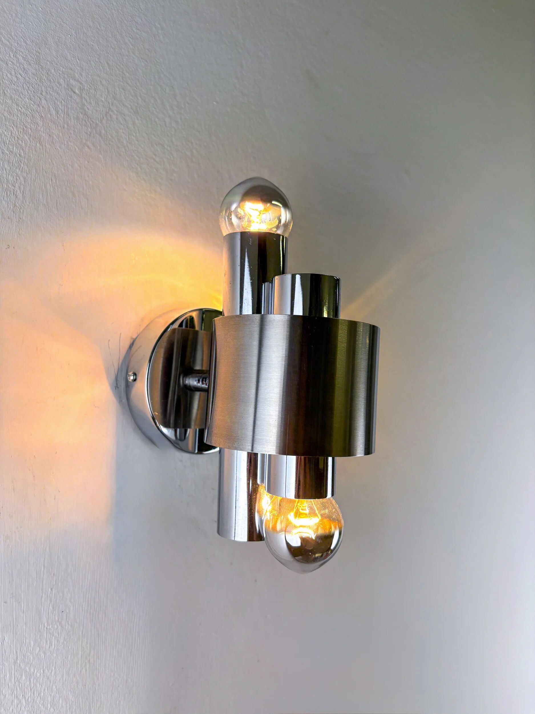 Pair of space age 2-light wall sconces, chromed metal, Italy, 1970s