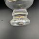 Eisch glass footed cup with pearlescent finish, blue rim.