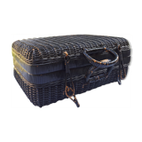 Old black wicker suitcase