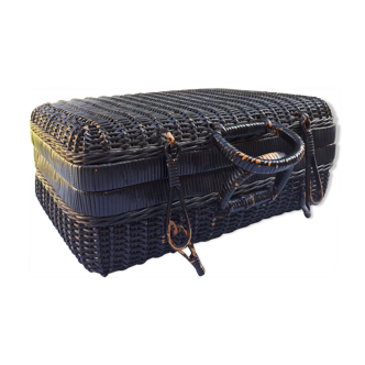 Old black wicker suitcase